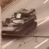 Russian tank runs over civilian car and driver survives