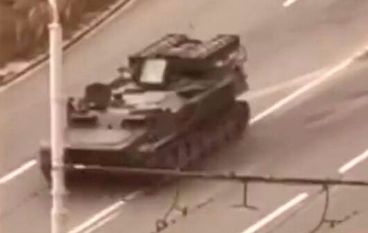 Russian tank runs over civilian car and driver survives