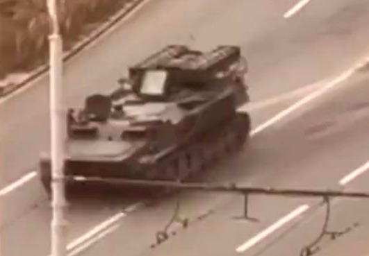 Russian tank runs over civilian car and driver survives